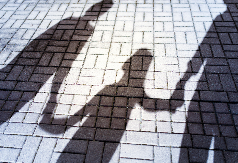 Family shadow holding hands