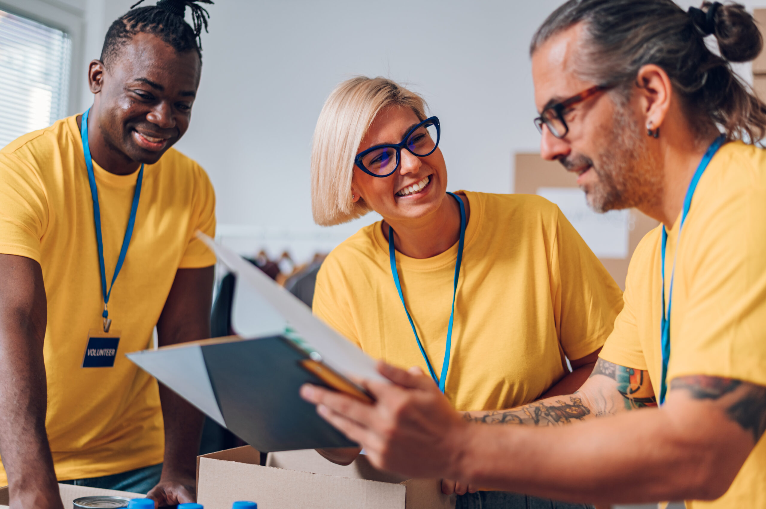 Group of multiracial volunteers working in community charity don