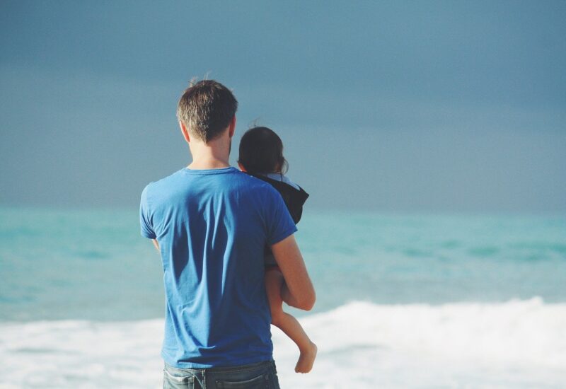 Father and son on beach