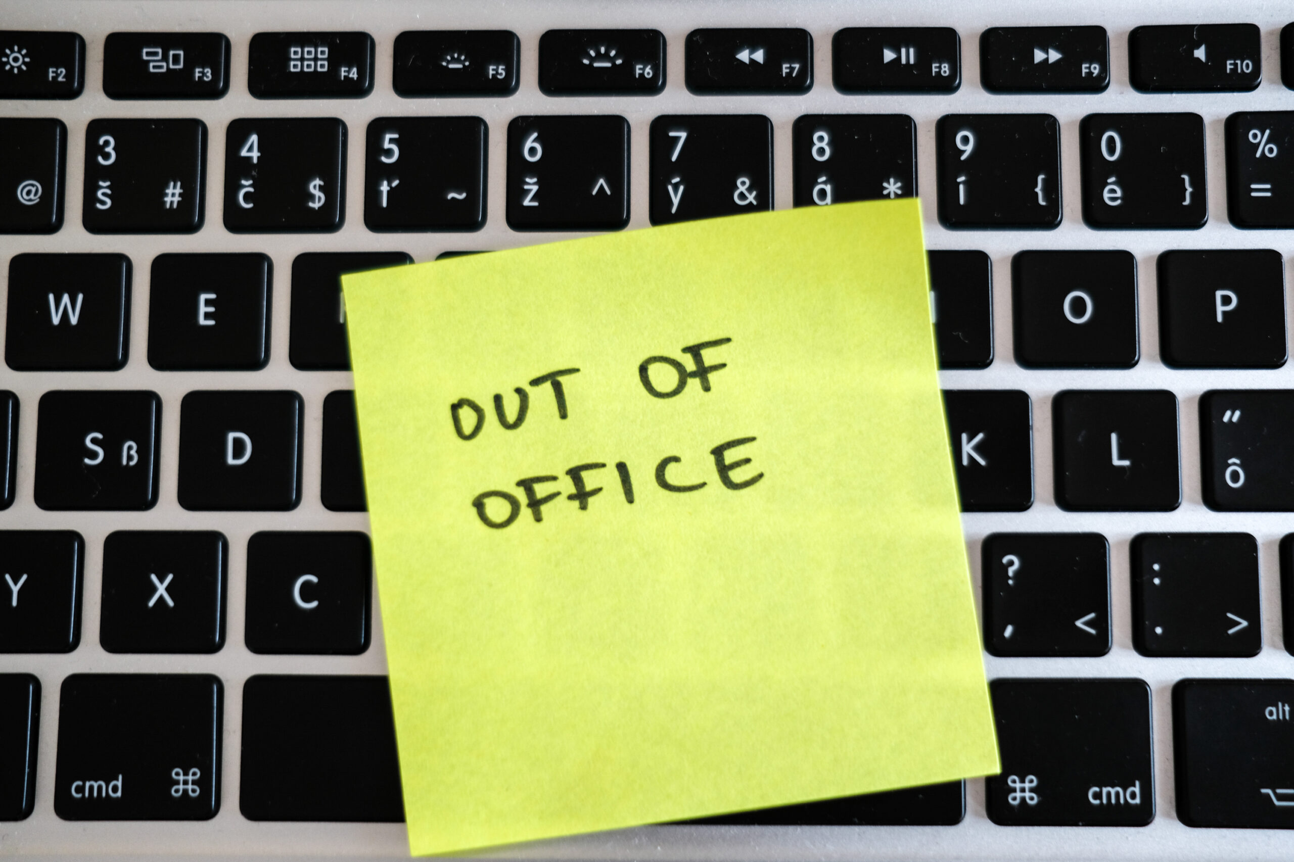 Vacation needed. Holiday office message on laptop. Out of office.