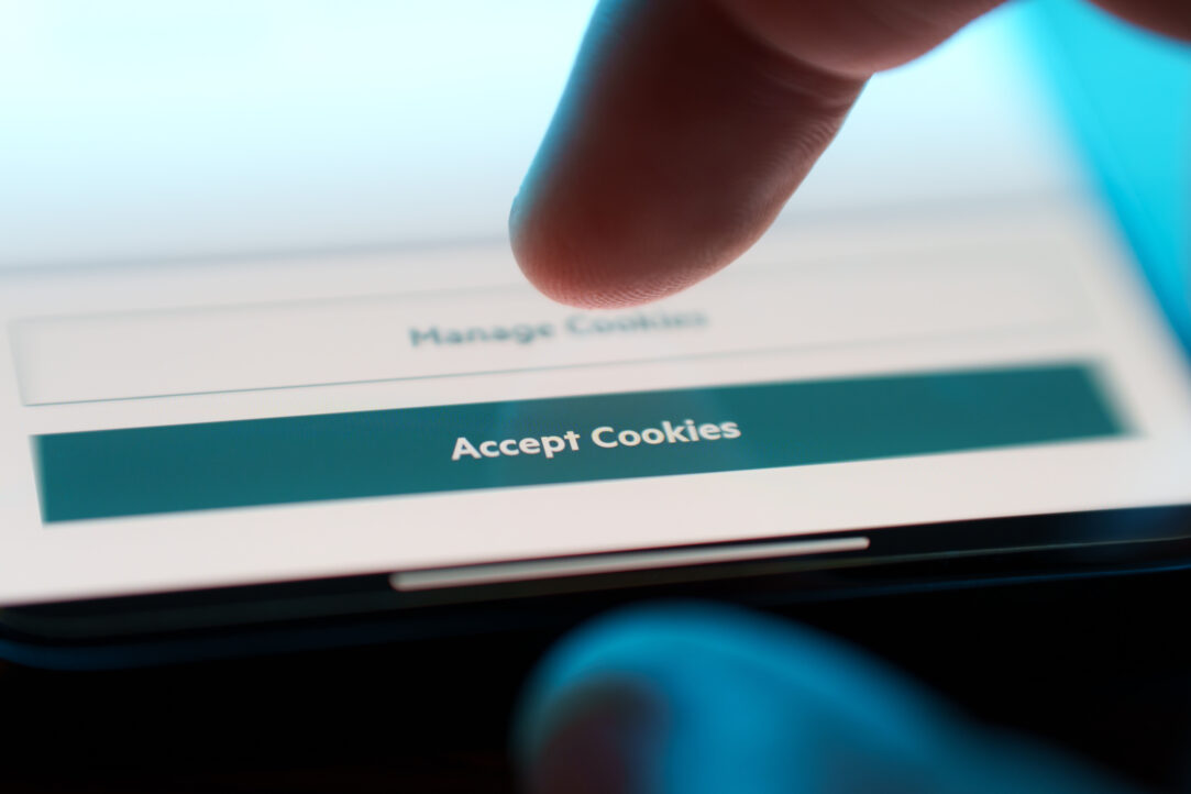Accept cookies button on internet webpage on smartphone. Internet browsing history data technology security concept.