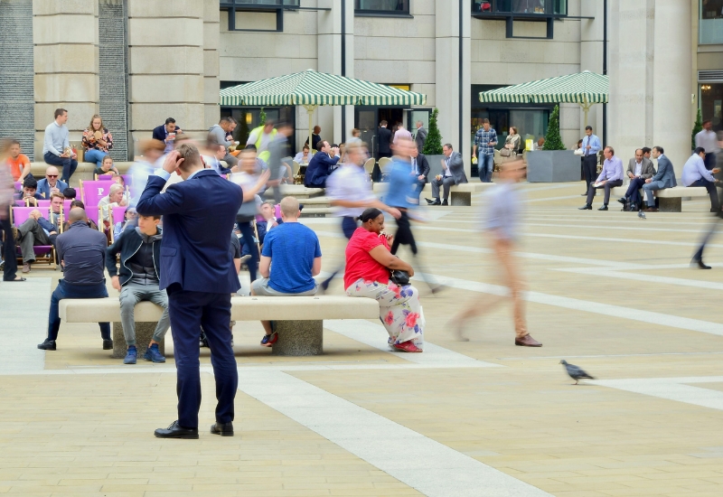 Image of hustle and bustle in a town center.