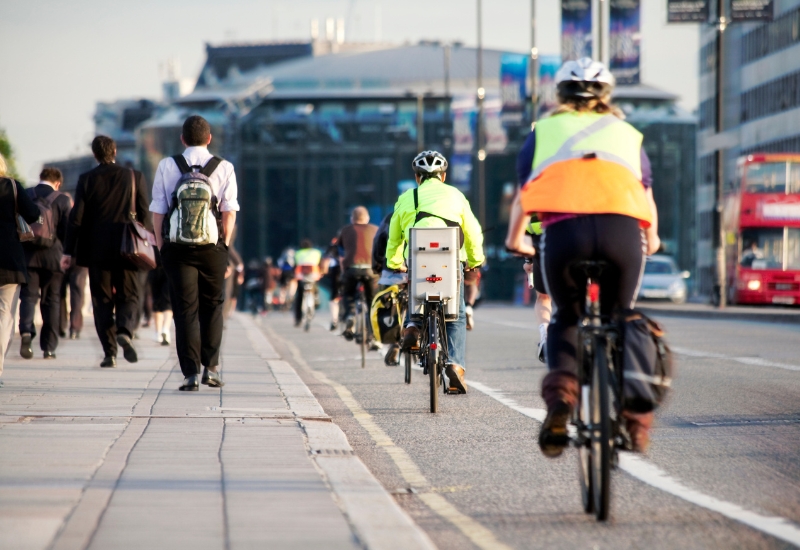 Cyclists on the road alongside pedestrians